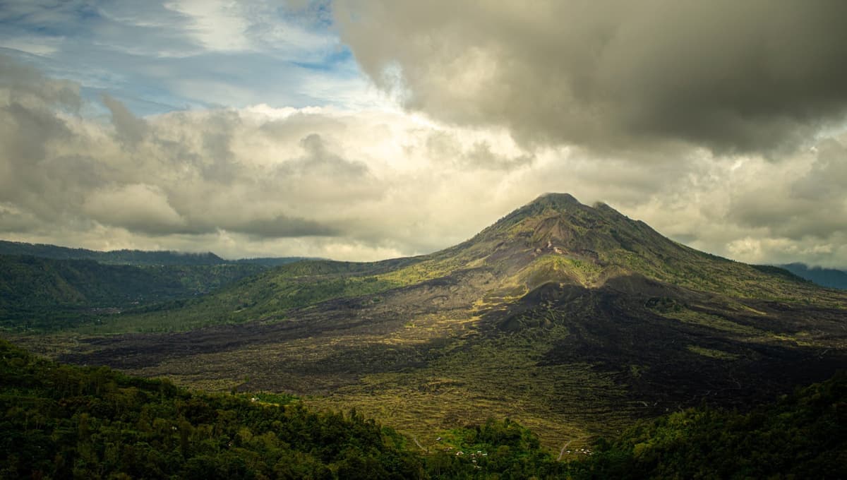 Mount Batur and Lake Batur | Bali | Go Bali Visa Agency Mount Batur volcano rising above Lake Batur under morning cloud in Bali